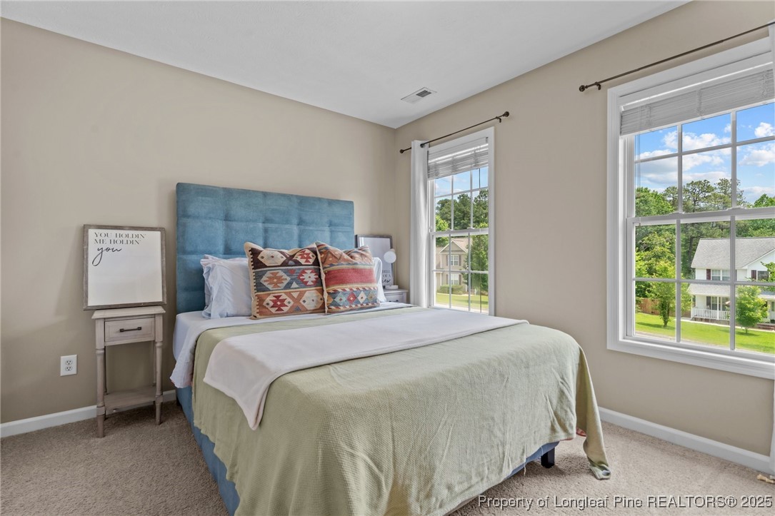 383 Yorkshire Drive Cameron, NC 28326 - Photo 30 of 49 a bedroom with a bed and a window