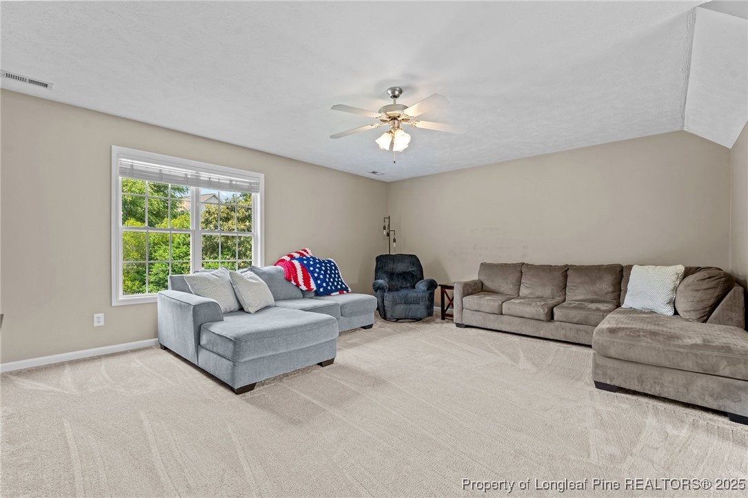383 Yorkshire Drive Cameron, NC 28326 - Photo 32 of 49 a living room with furniture and a large window