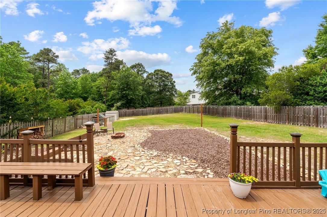 383 Yorkshire Drive Cameron, NC 28326 - Photo 38 of 49 a view of a roof deck with wooden floor and fence