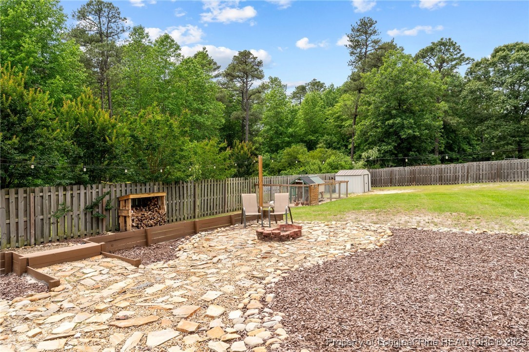 383 Yorkshire Drive Cameron, NC 28326 - Photo 39 of 49 a view of a swimming pool with a patio and a yard