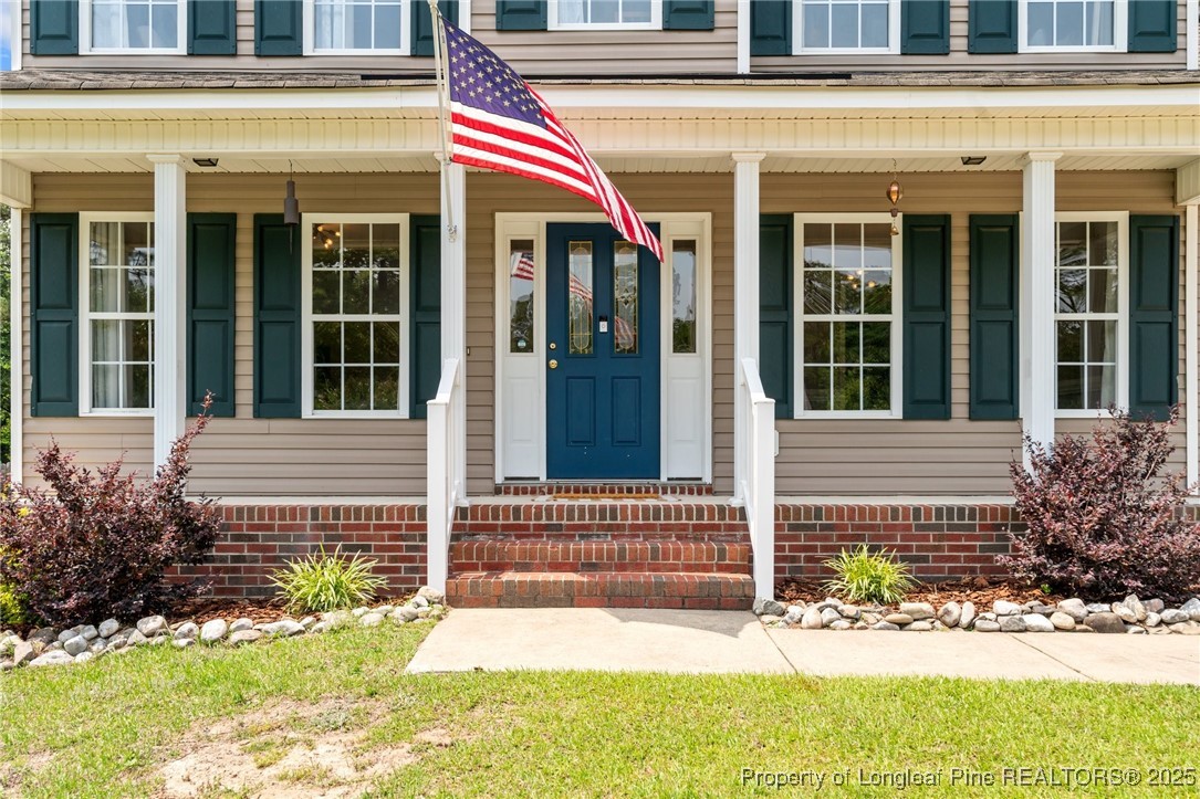 383 Yorkshire Drive Cameron, NC 28326 - Photo 6 of 49 front view of house with a yard