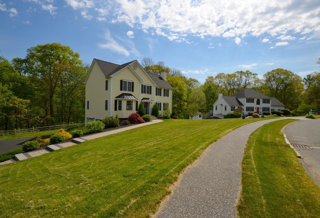 33 Boundary Stone Road Sutton, MA 01590 - Photo 36 of 39 a front view of a house with a yard
