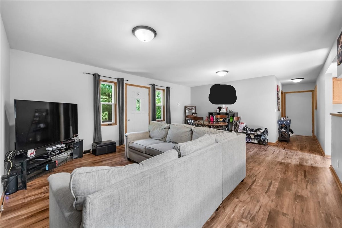 1834 Fischer Road South Beloit, IL 61080 - Photo 12 of 46 a living room with furniture and a flat screen tv