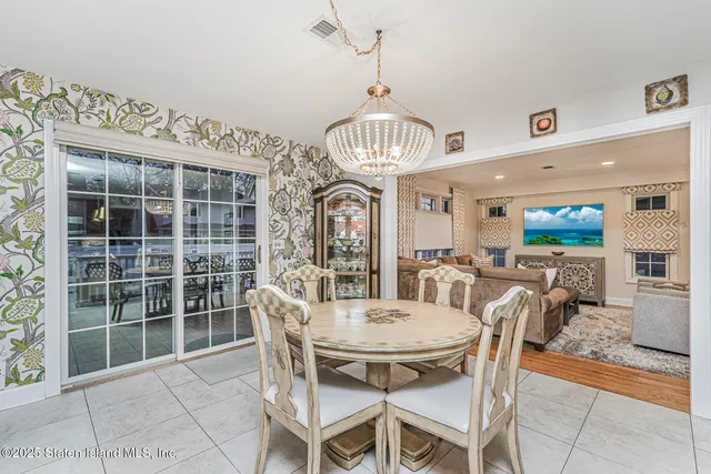 a view of a dining room with furniture window and outside view