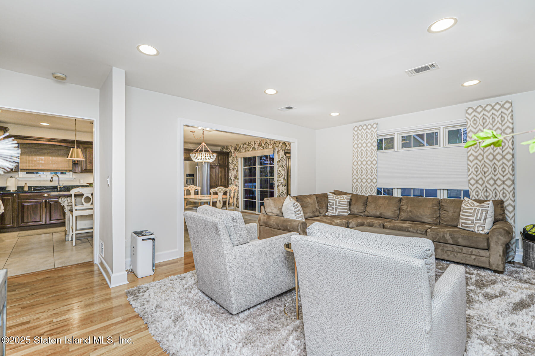 133 Goodwin Avenue Staten Island, NY 10314 - Photo 17 of 54 a living room with furniture and a wooden floor