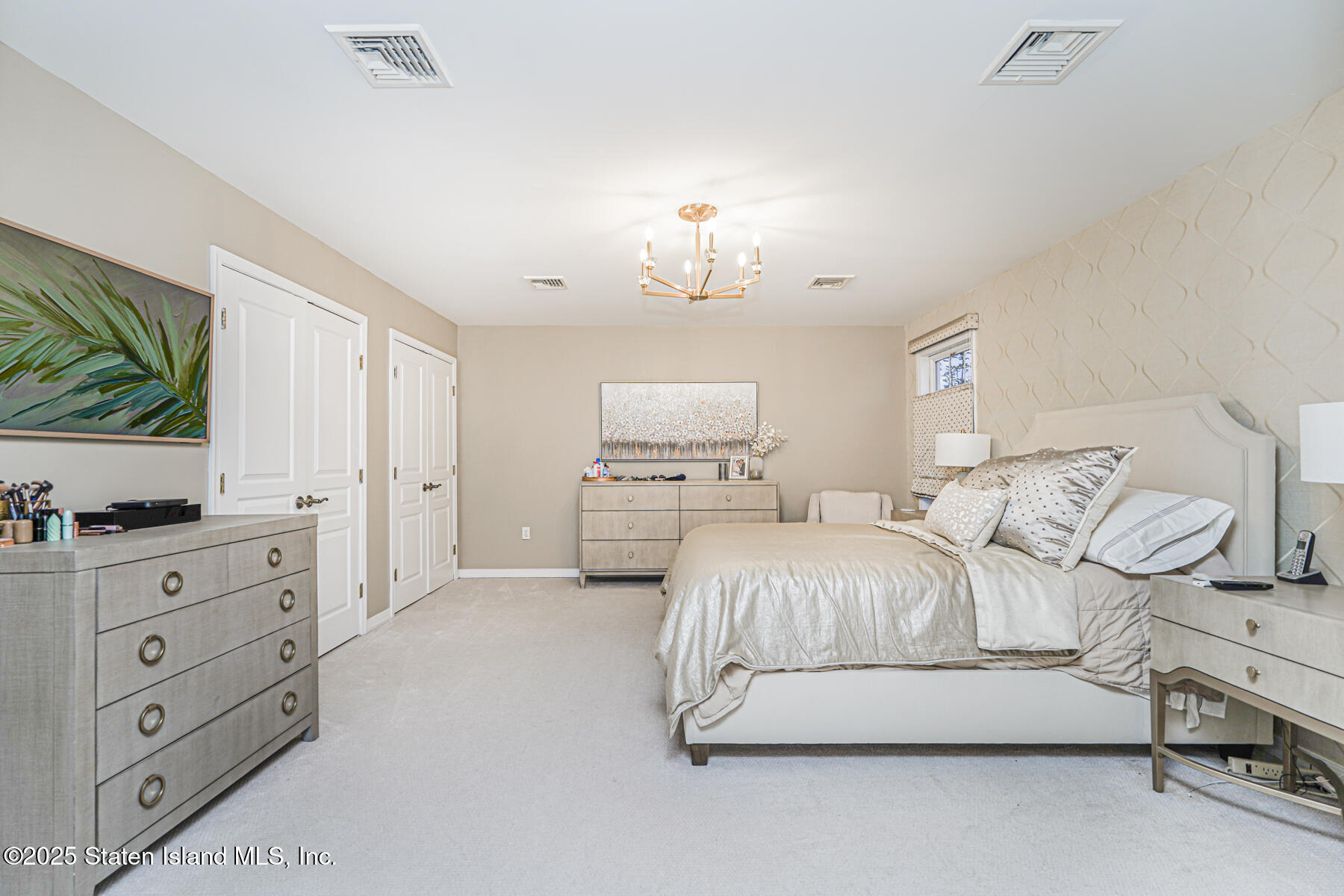 133 Goodwin Avenue Staten Island, NY 10314 - Photo 25 of 54 a spacious bedroom with a bed and a flat screen tv
