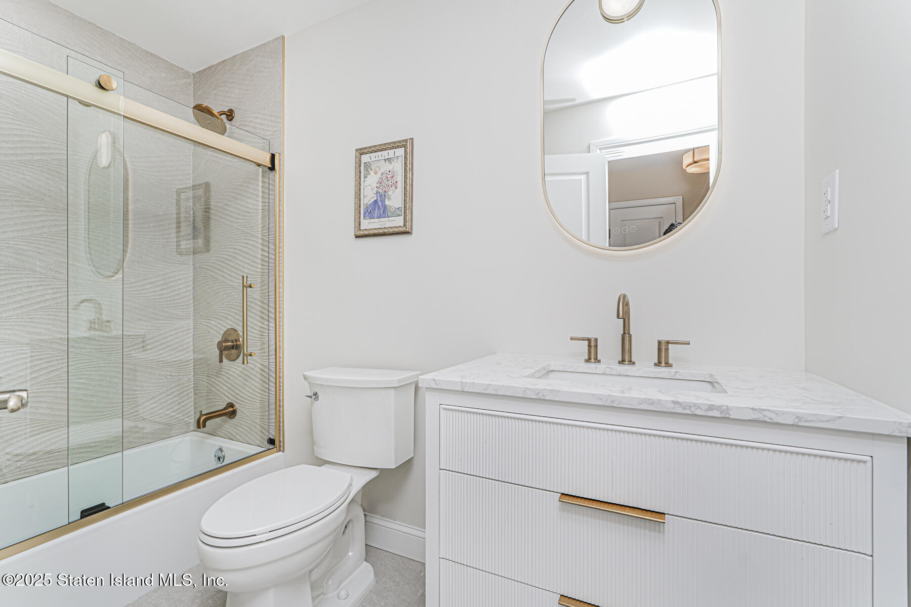 133 Goodwin Avenue Staten Island, NY 10314 - Photo 31 of 54 a bathroom with a sink a toilet and a mirror
