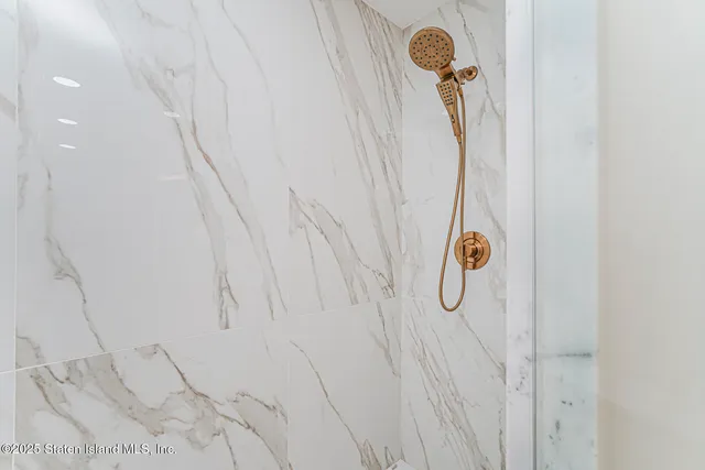 a living room with furniture a flat screen tv and a window