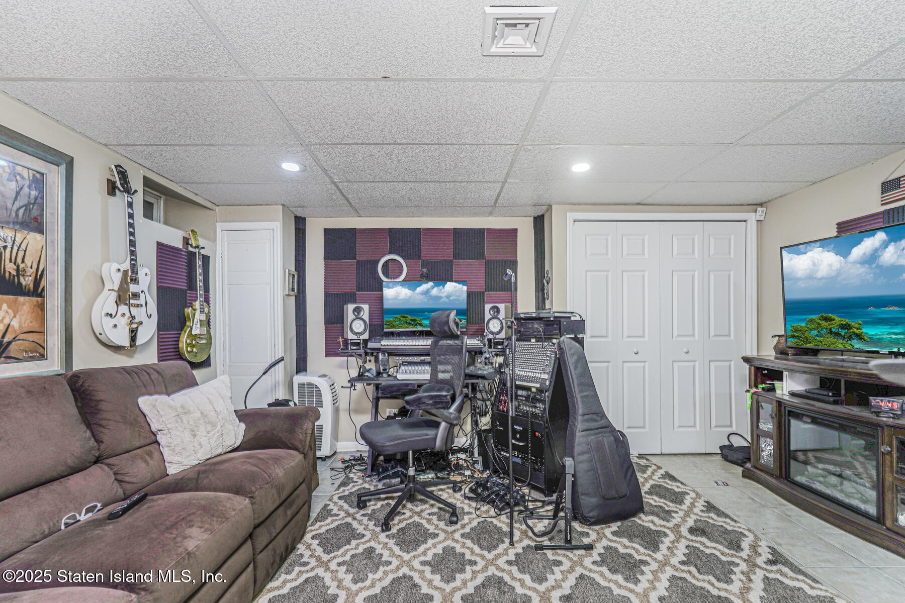 133 Goodwin Avenue Staten Island, NY 10314 - Photo 36 of 54 a living room with furniture a flat screen tv and a window