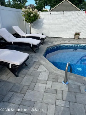 a view of a room with furniture and a potted plant