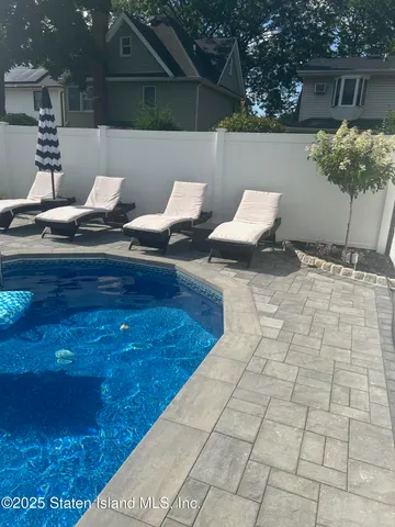 a view of an outdoor space with a swimming pool