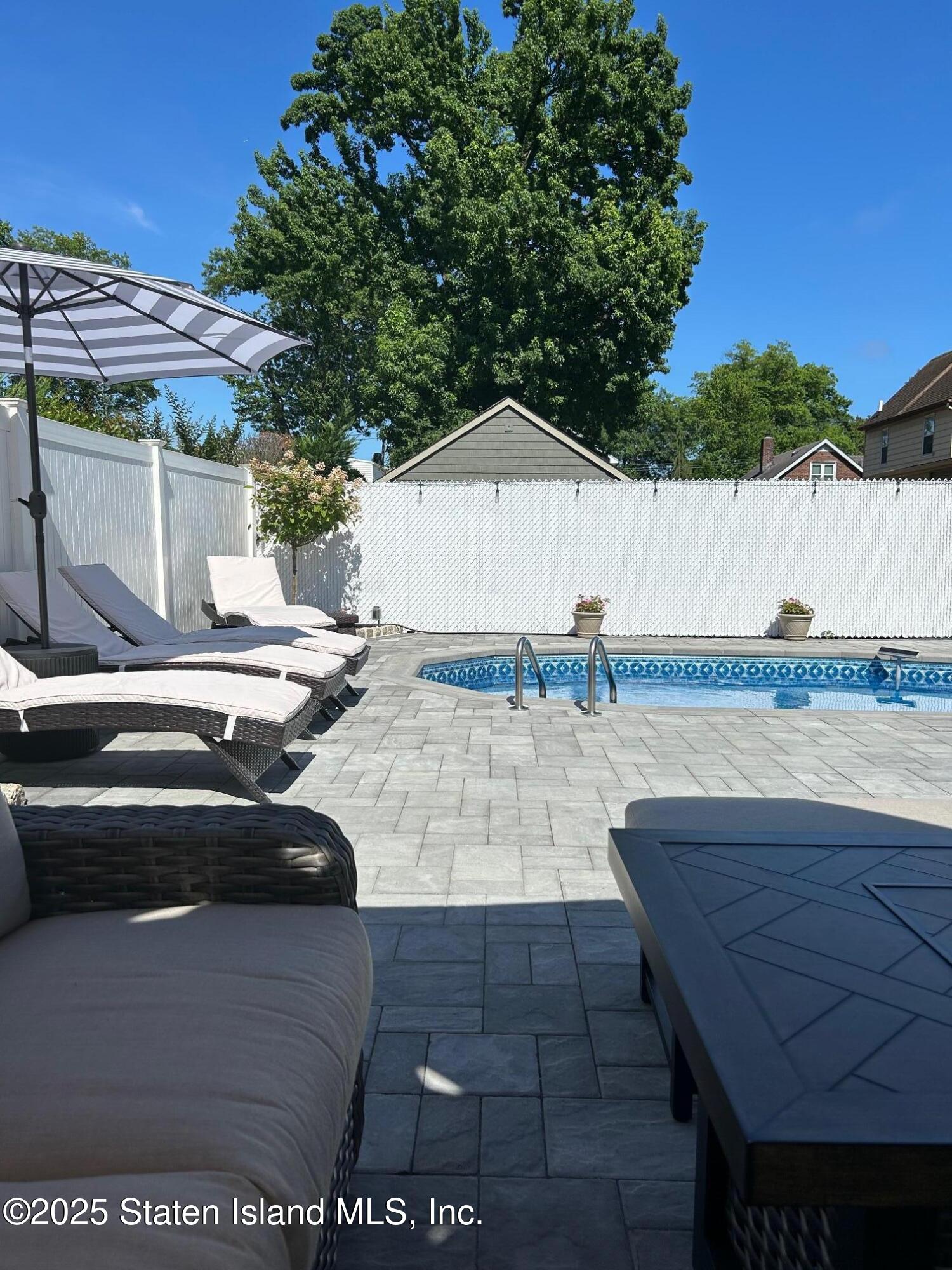 133 Goodwin Avenue Staten Island, NY 10314 - Photo 43 of 54 a view of outdoor space with swimming pool and patio