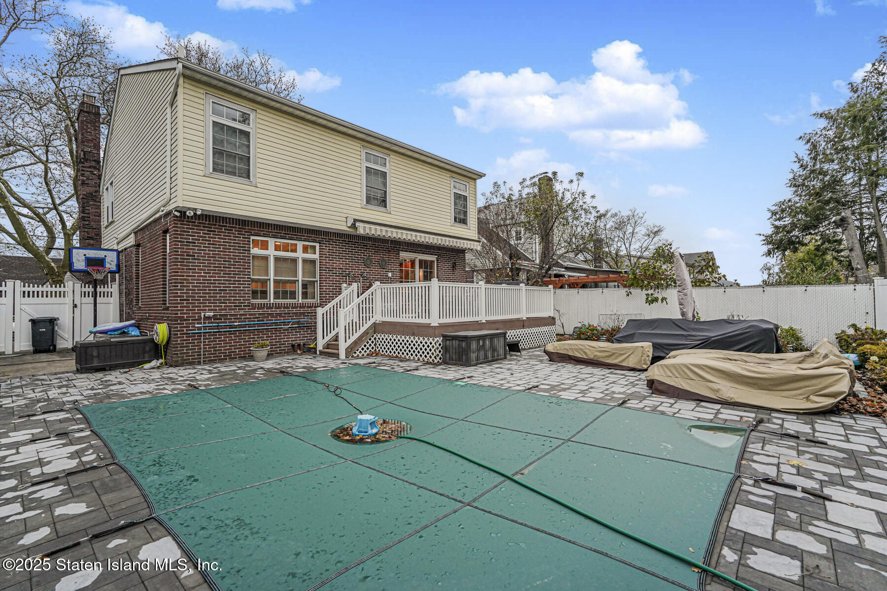 133 Goodwin Avenue Staten Island, NY 10314 - Photo 50 of 54 a view of a house with backyard and sitting area