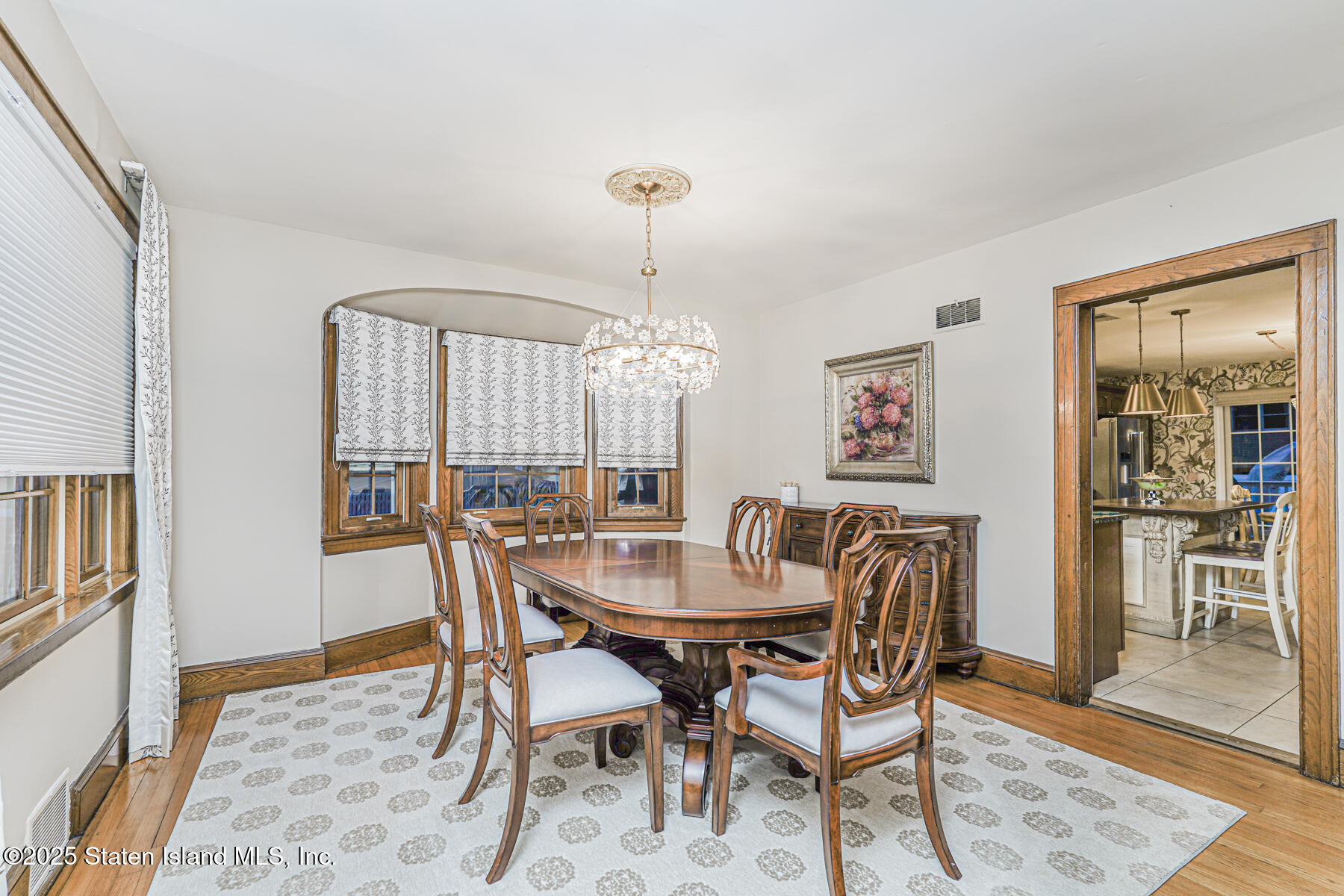 133 Goodwin Avenue Staten Island, NY 10314 - Photo 9 of 54 a view of a dining room with furniture and wooden floor
