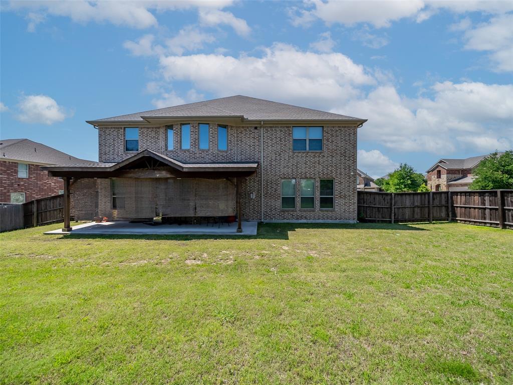 5207 Seth Avenue Sachse, TX 75048 - Photo 11 of 28 Back of house featuring a patio area and brick siding