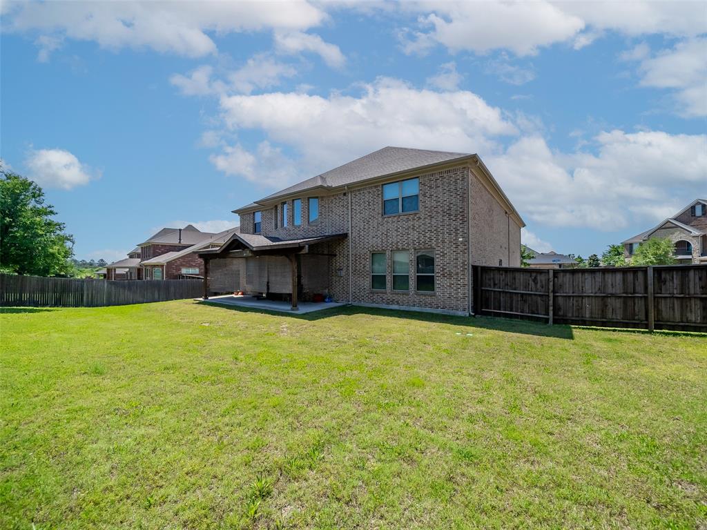 5207 Seth Avenue Sachse, TX 75048 - Photo 12 of 28 Rear view of house featuring a patio area and brick siding
