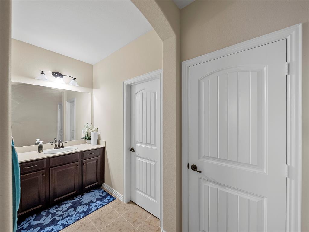 5207 Seth Avenue Sachse, TX 75048 - Photo 20 of 28 Bathroom with vanity and tile patterned floors