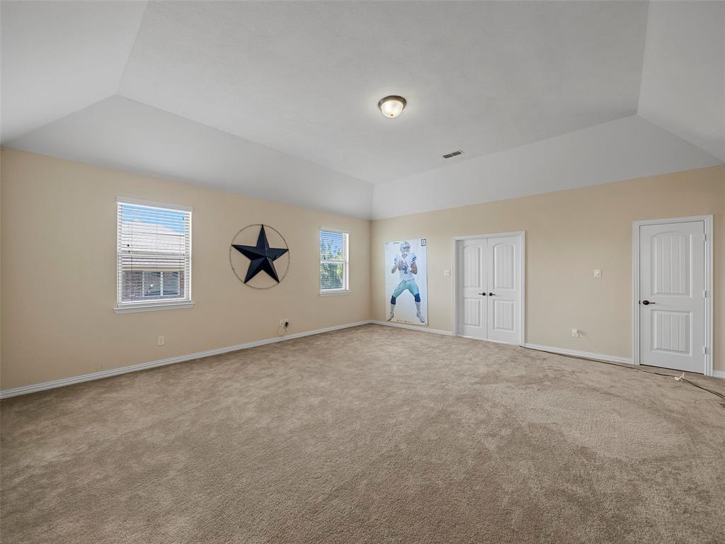 5207 Seth Avenue Sachse, TX 75048 - Photo 24 of 28 Unfurnished bedroom featuring lofted ceiling, carpet, and baseboards