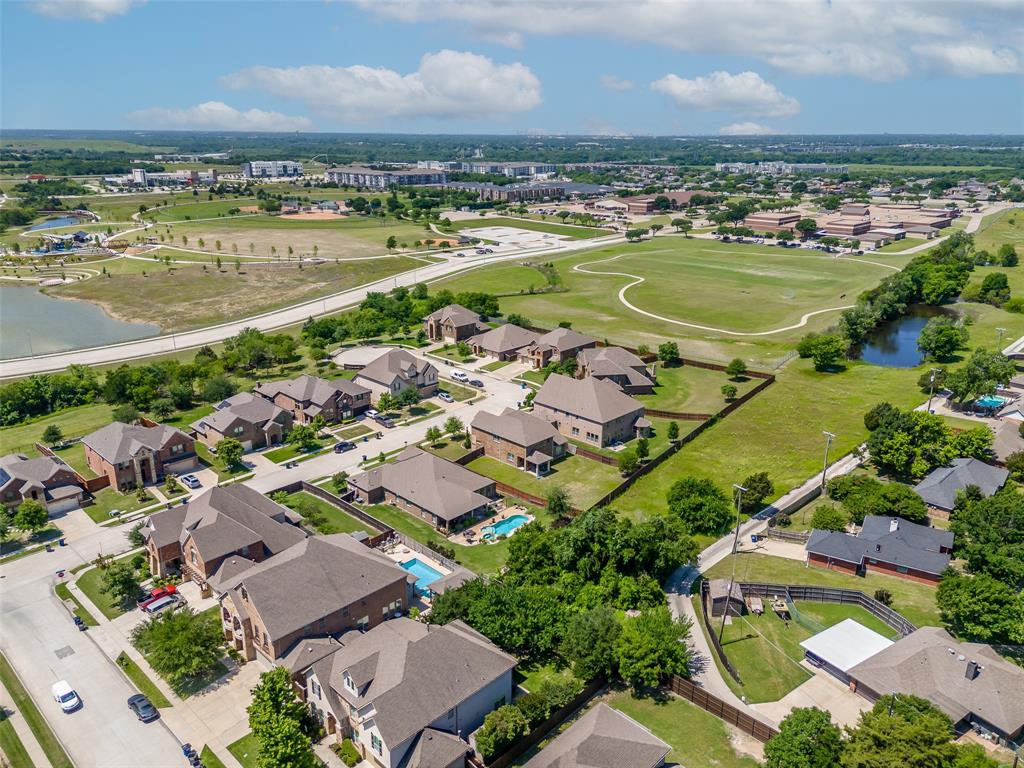 5207 Seth Avenue Sachse, TX 75048 - Photo 6 of 28 Aerial perspective of suburban area with a nearby body of water