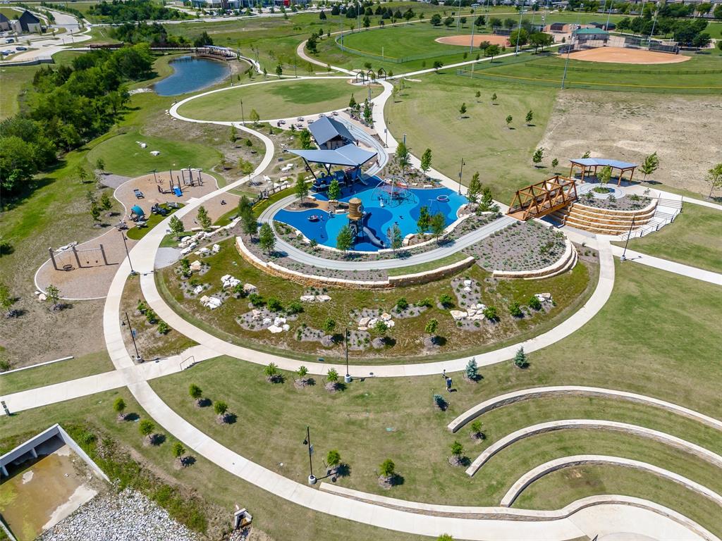 5207 Seth Avenue Sachse, TX 75048 - Photo 8 of 28 Aerial view of a nearby body of water and a pool area