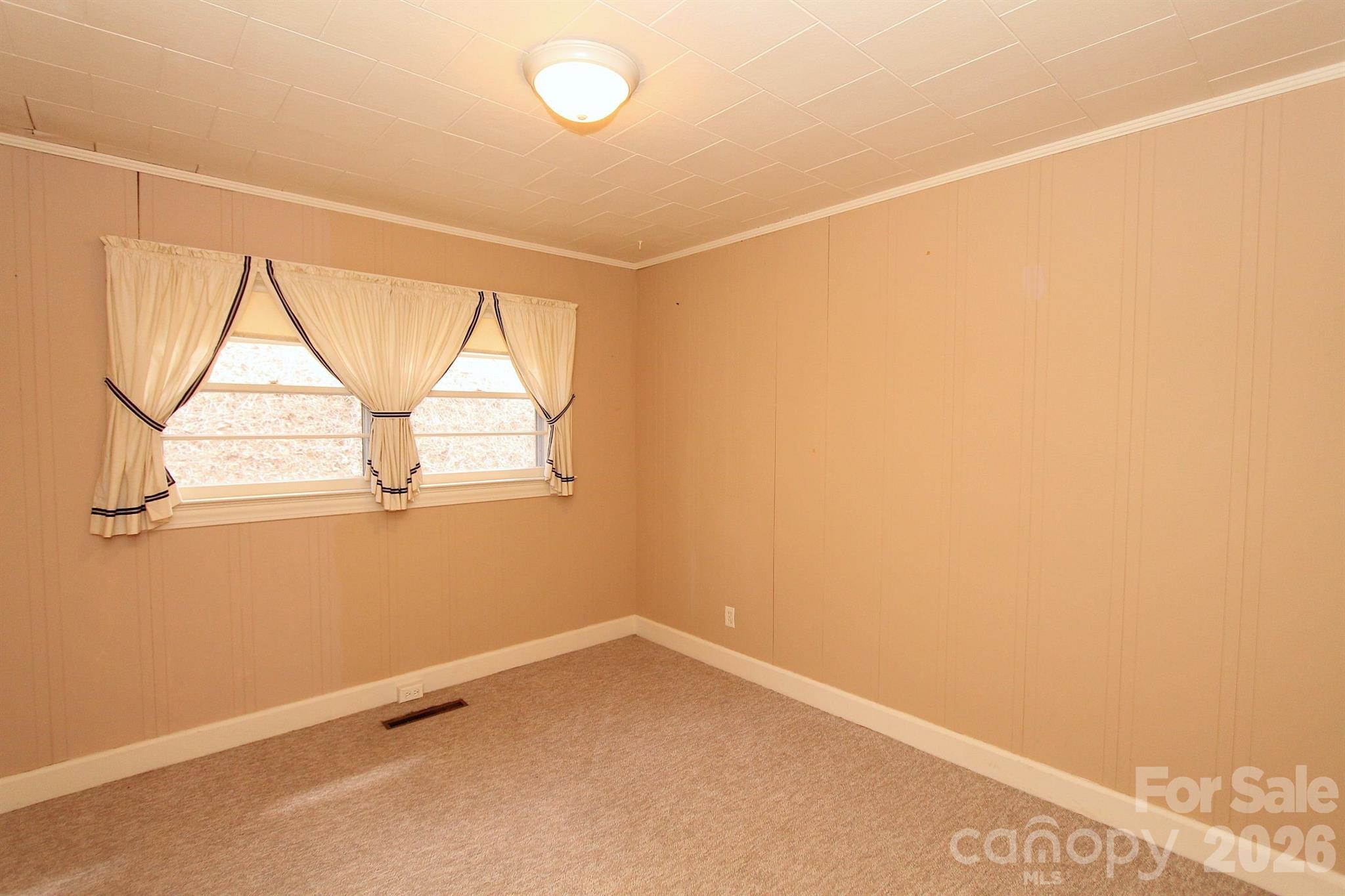 407 Turley Falls Road Hendersonville, NC 28739 - Photo 15 of 28 an empty room with a window