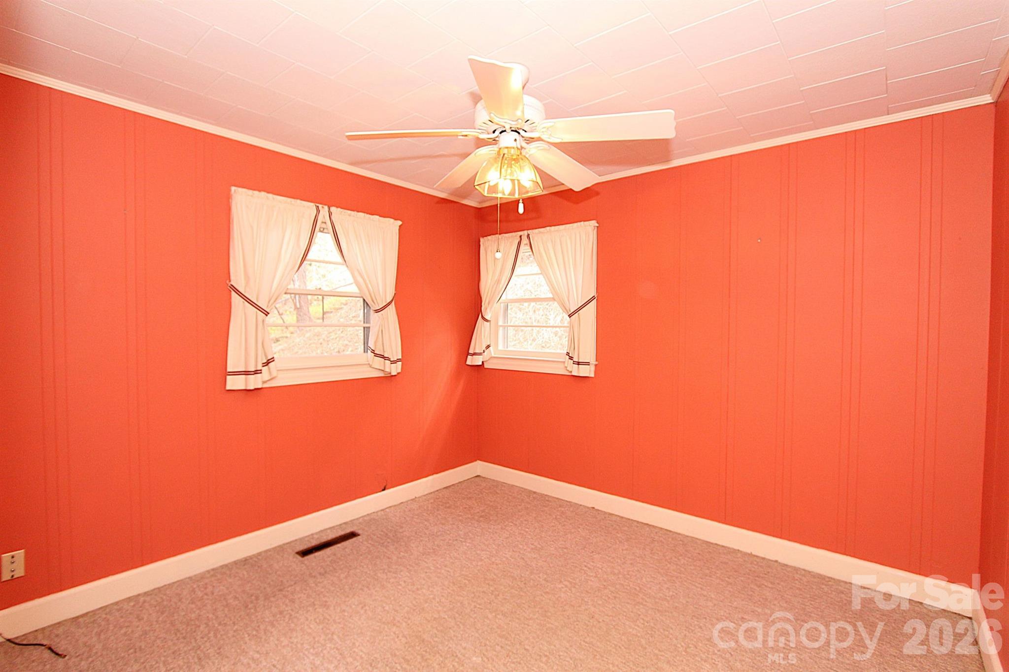 407 Turley Falls Road Hendersonville, NC 28739 - Photo 16 of 28 a view of a big room with window and chandelier fan