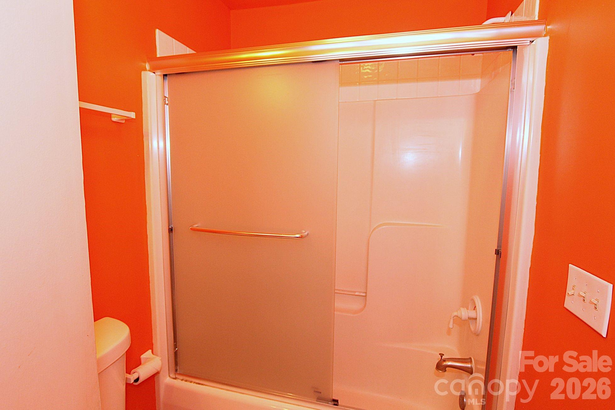 407 Turley Falls Road Hendersonville, NC 28739 - Photo 21 of 28 a bathroom with a shower and a toilet