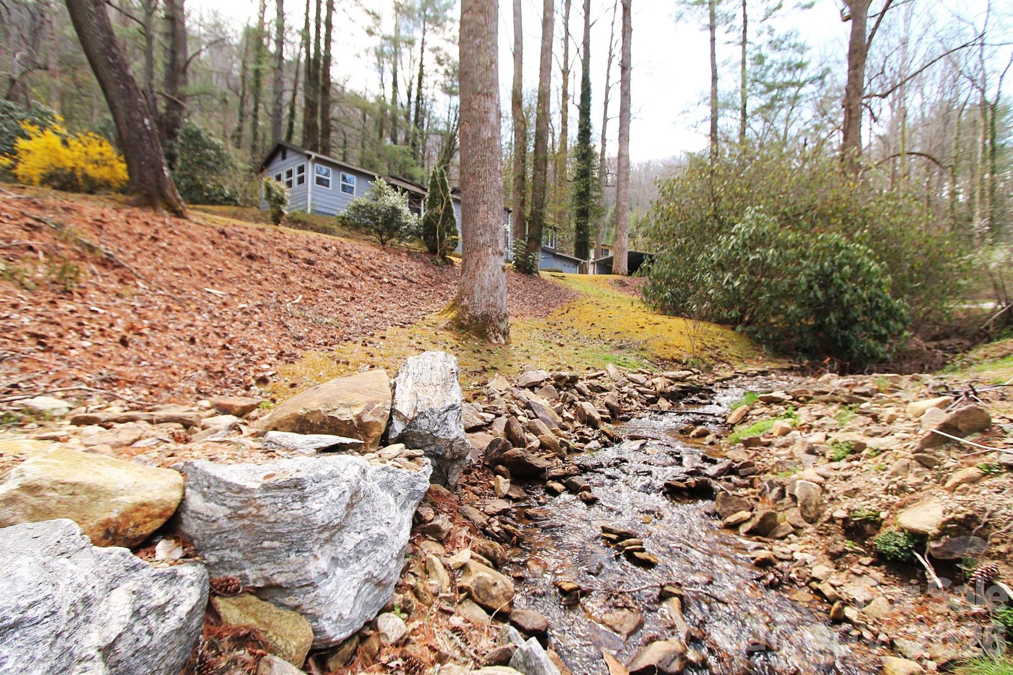 407 Turley Falls Road Hendersonville, NC 28739 - Photo 28 of 28 a view of the yard covered with snow