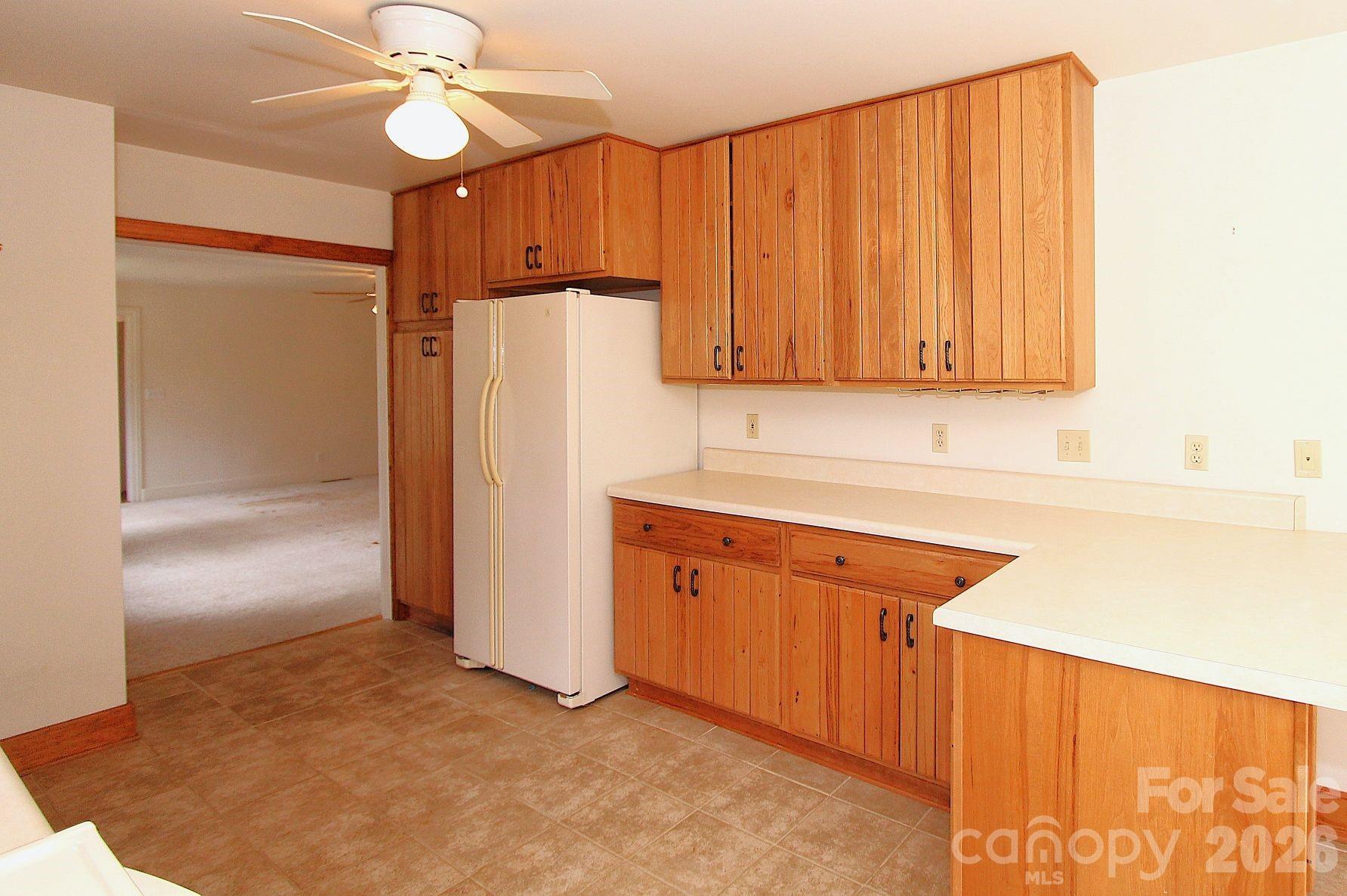 407 Turley Falls Road Hendersonville, NC 28739 - Photo 9 of 28 a kitchen with stainless steel appliances granite countertop a refrigerator a sink and dishwasher