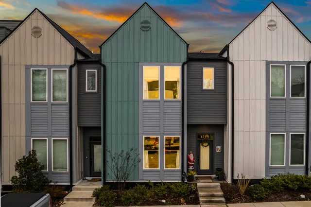 a front view of a house with glass windows