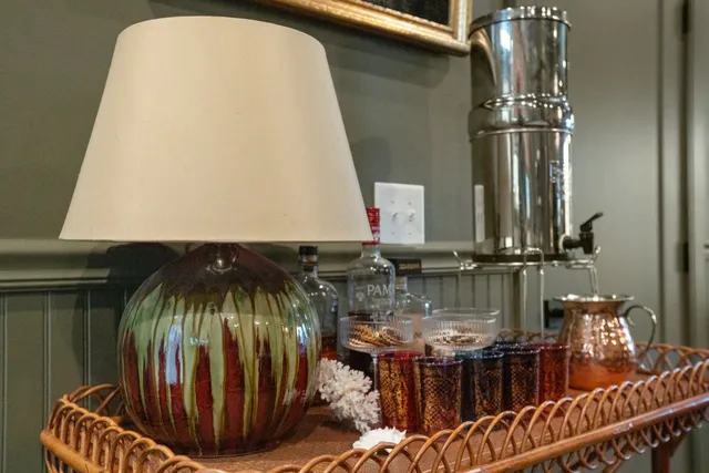 a kitchen with a sink and a mirror