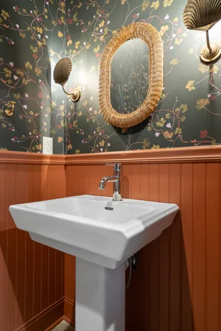 a bathroom with a sink and mirror