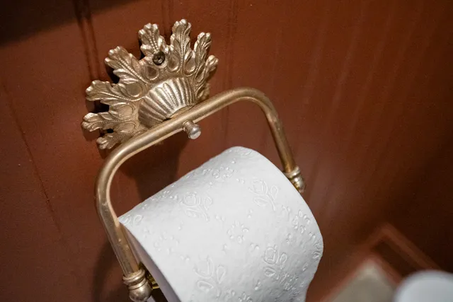 a bathroom with a sink a mirror and a toilet