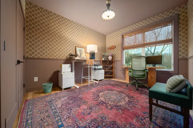 a bedroom with bed and window