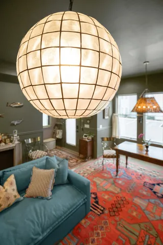 a living room with couch and a large window