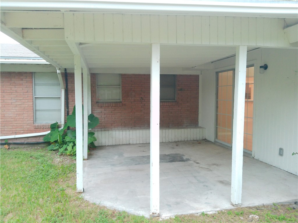 109 Sutherland Drive Portland, TX 78374 - Photo 16 of 17 a view of a brick house with a outdoor space