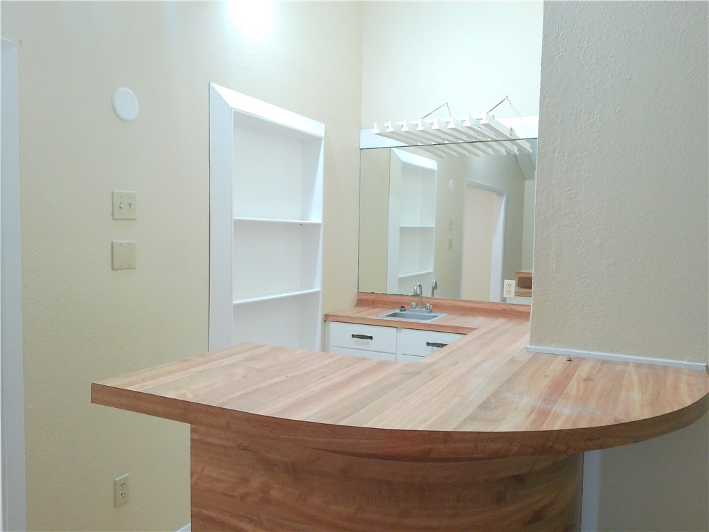 109 Sutherland Drive Portland, TX 78374 - Photo 10 of 17 a bathroom with a sink and a mirror