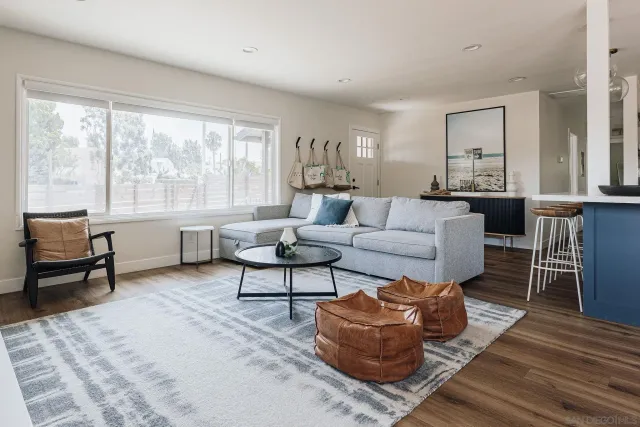 a living room with furniture fireplace and window
