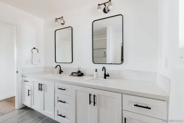 a bedroom with a bed and a night stand