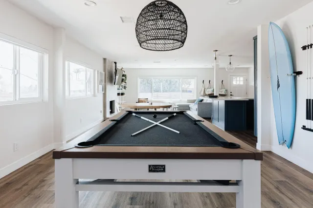 a dining room with furniture and wooden floor