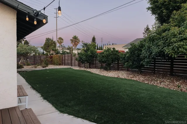a kitchen with a refrigerator and cabinets