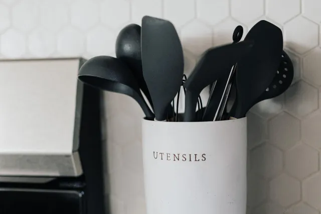 a living room with furniture and a lamp