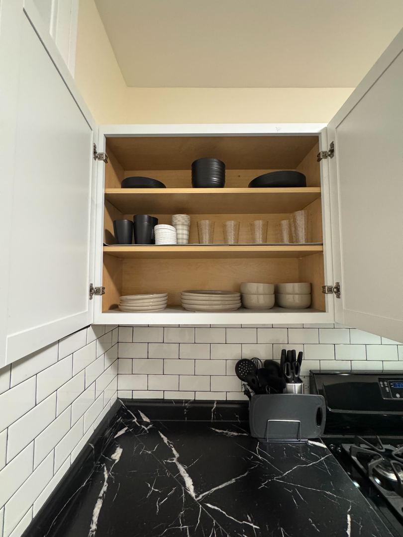 610 East 74th Street, Unit 1B Chicago, IL 60619 - Photo 13 of 15 a view of table and chair in the kitchen
