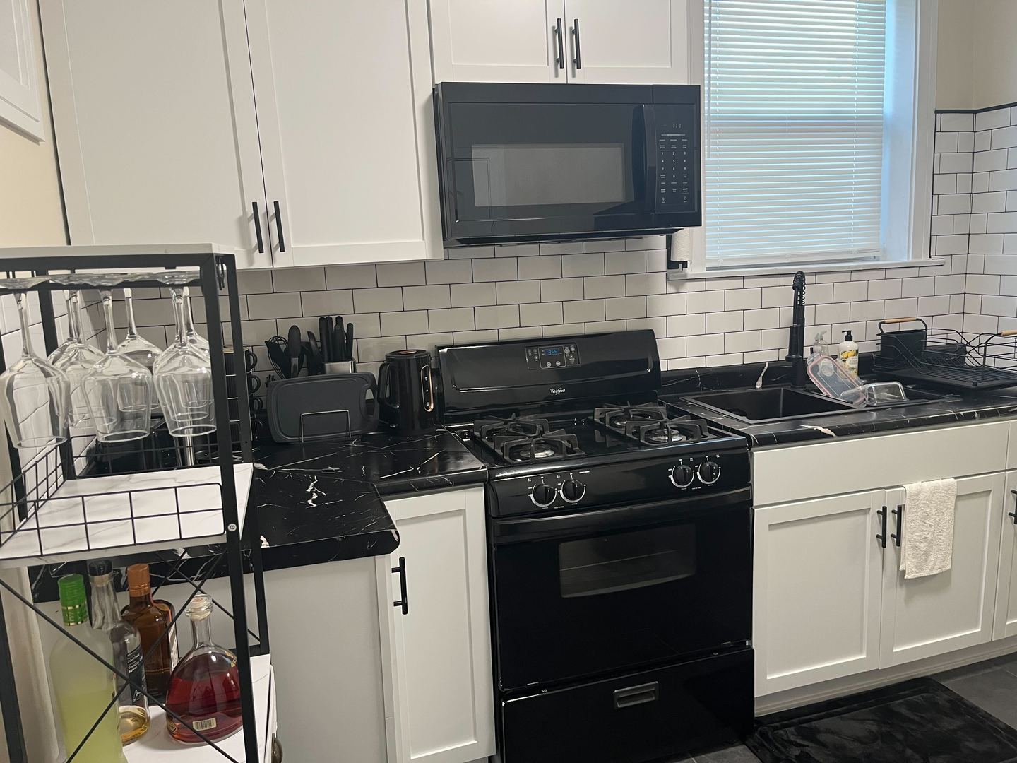 610 East 74th Street, Unit 1B Chicago, IL 60619 - Photo 14 of 15 a kitchen with a sink stove and microwave