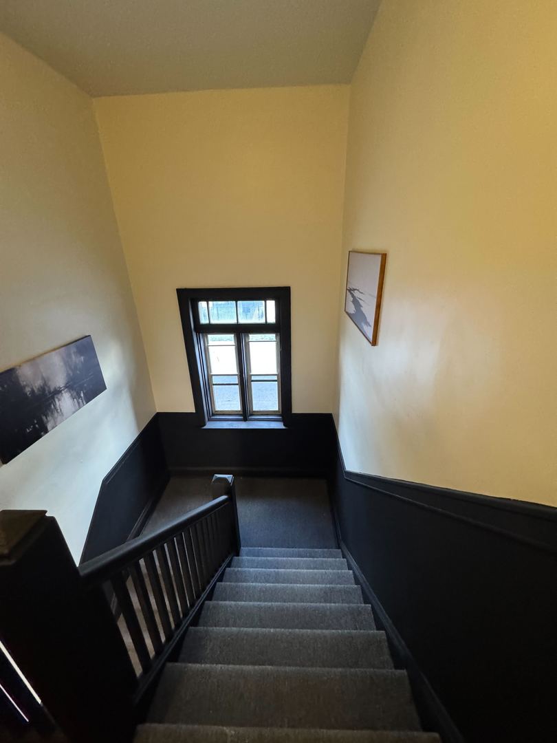 610 East 74th Street, Unit 1B Chicago, IL 60619 - Photo 2 of 15 a view of entryway and hall with wooden floor