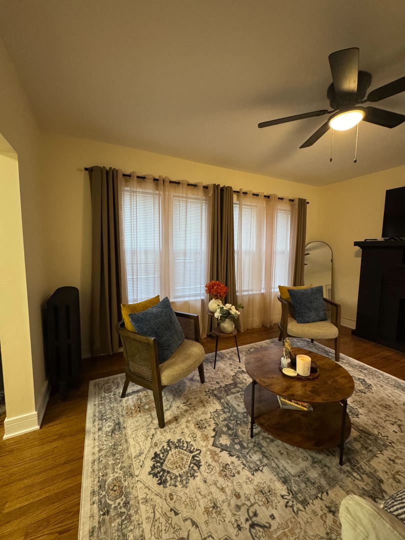 610 East 74th Street, Unit 1B Chicago, IL 60619 - Photo 6 of 15 a living room with furniture and wooden floor