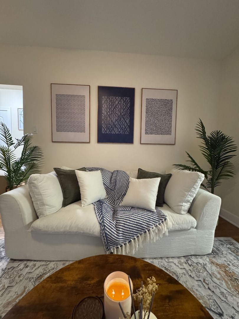 610 East 74th Street, Unit 1B Chicago, IL 60619 - Photo 8 of 15 a living room with furniture