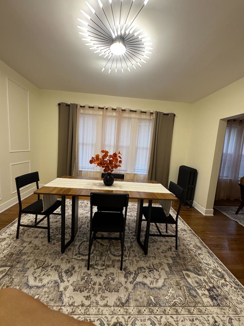 610 East 74th Street, Unit 1B Chicago, IL 60619 - Photo 9 of 15 a dining room with furniture and window