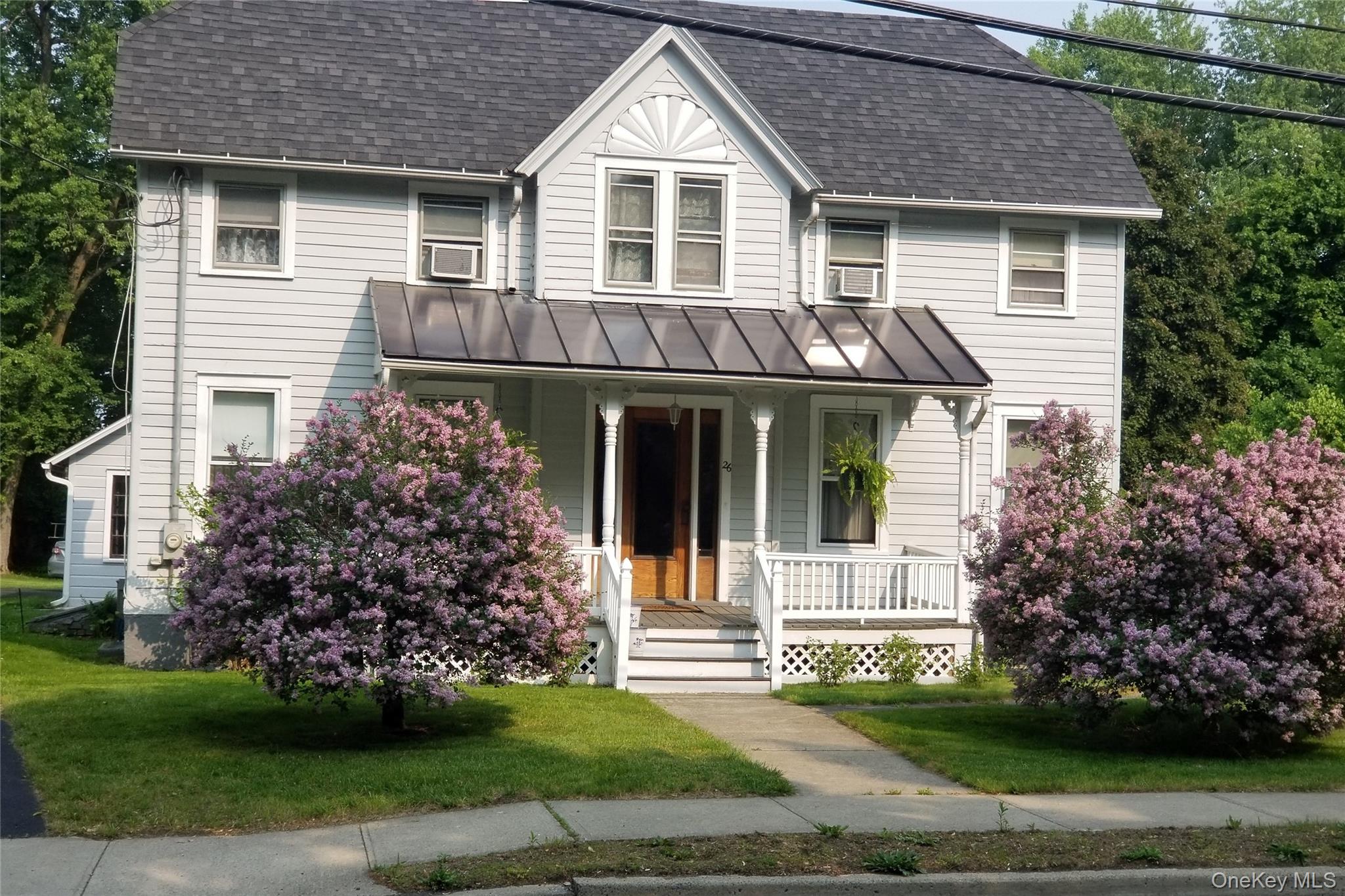 26 Chatham Street Kinderhook, NY 12106 - Photo 1 of 18 a front view of a house with a garden