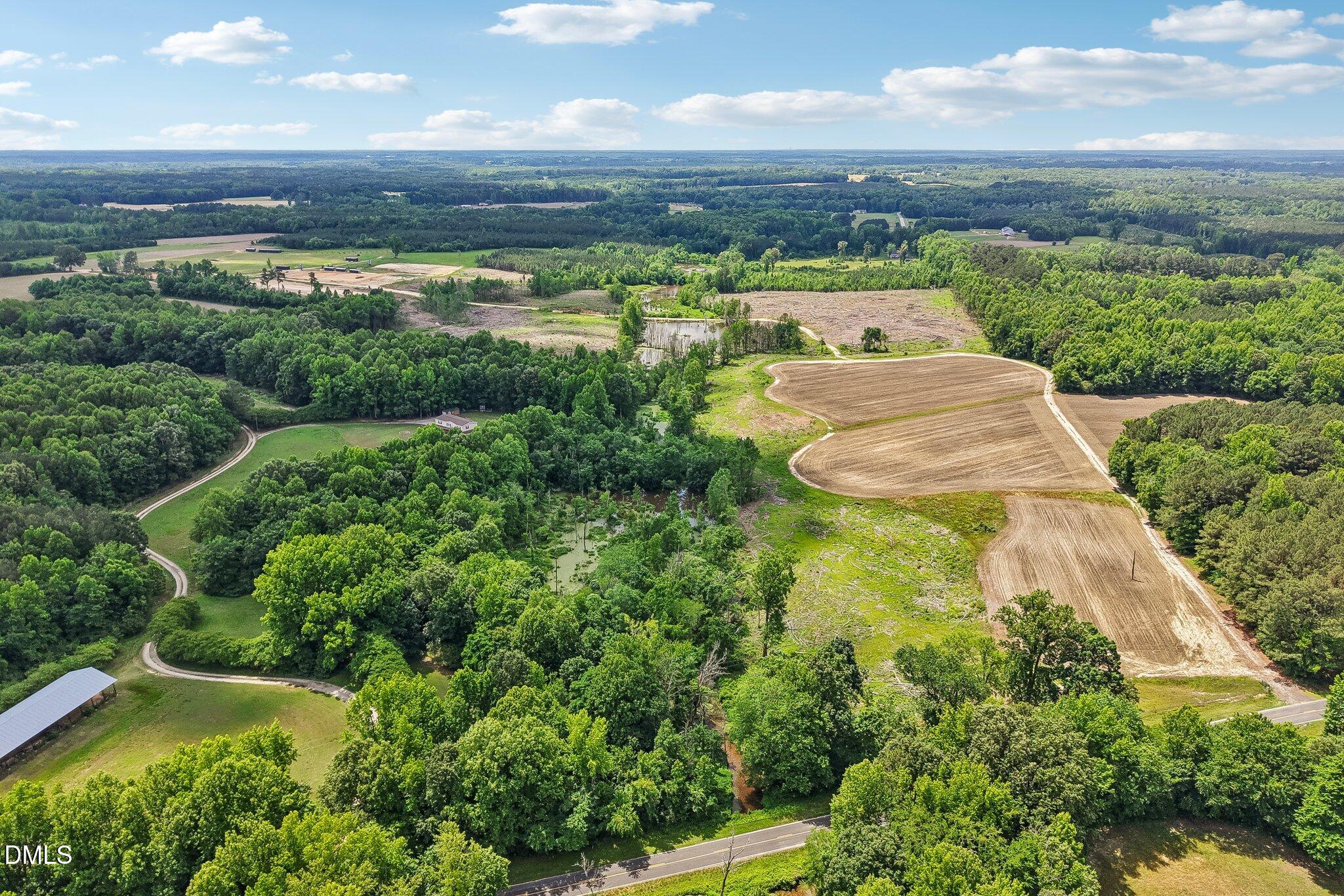89 Nash County Line Road Castalia, NC 27816 - Photo 11 of 12 an aerial view of a residential houses with outdoor space and trees